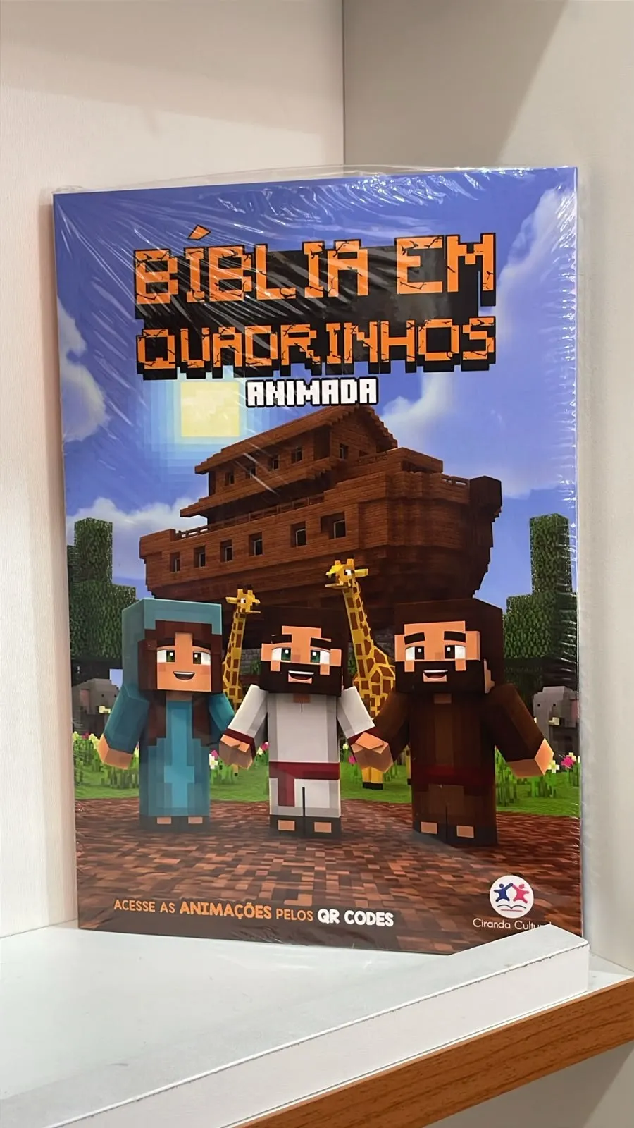 Bíblia em Quadrinhos Animada com capa ao estilo de blocos e a arca de Noé